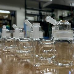 Electrochemical H-cell designed at Cornell and replicated within tight tolerances.